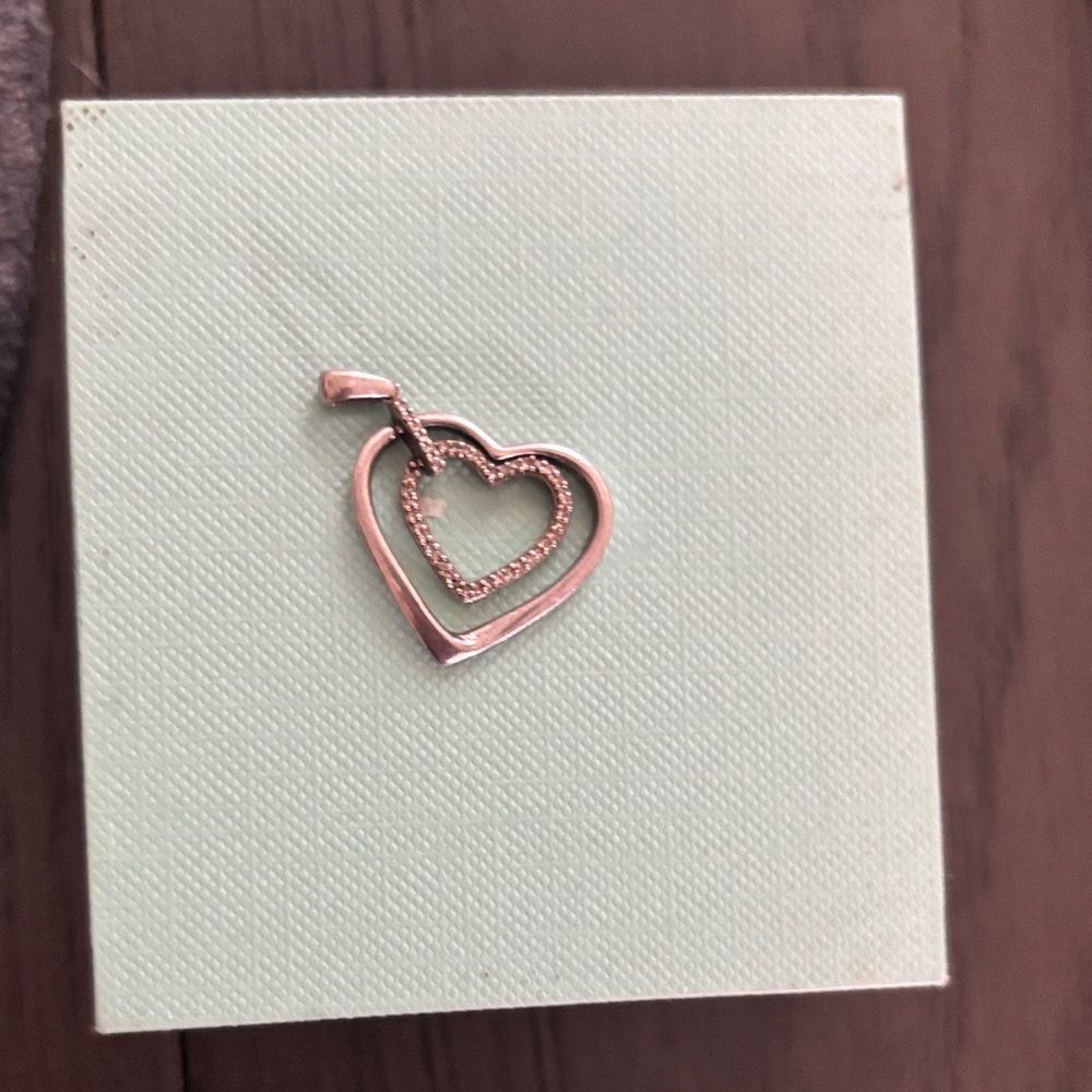 Elegant Gold / diamond Heart Pendant. Silver . Comes with chain .
